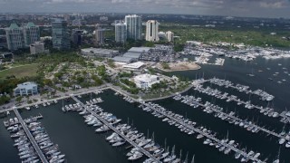 AX0172_008 - 6.7K stock footage aerial video fly over marina to circle city hall, Miami, Florida