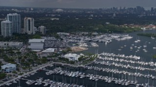 AX0172_012 - 6.7K aerial stock footage flyby Miami City Hall, reveal distant skyline in Miami, Florida