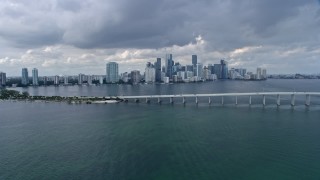AX0172_016 - 6.7K stock footage aerial video flyby the Rickenbacker Causeway with a view of Downtown Miami skyline, Florida