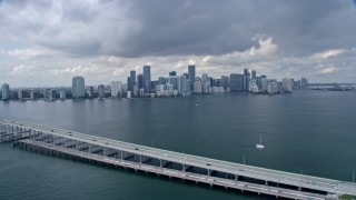 AX0172_017 - 6.7K aerial stock footage of a view of Downtown Miami skyline, seen from Rickenbacker Causeway, Florida