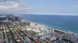 AX0172_027 - 6.7K aerial stock footage fly over condos and hotels to reveal beach in Bal Harbour, Florida