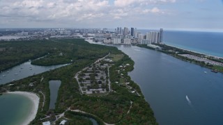 AX0172_030 - 6.7K aerial stock footage flyby FIU Biscayne Bay Campus in North Miami, Florida, approach beachfront condos in Sunny Isles Beach