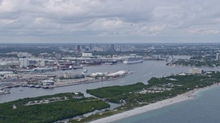 AX0172_041 - 6.7K aerial stock footage of Downtown Fort Lauderdale, Florida behind cruise ships at Port Everglades