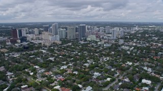 AX0172_045 - 6.7K aerial stock footage tilt from bird's eye view of waterfront homes to reveal Downtown Fort Lauderdale, Florida