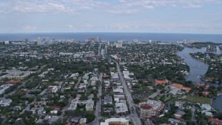 AX0172_049 - 6.7K aerial stock footage of flying over neighborhoods toward the coast in Fort Lauderdale, Florida