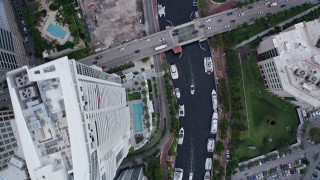 AX0172_058 - 6.7K aerial stock footage a bird's eye of yachts docked on New River in Downtown Fort Lauderdale, Florida