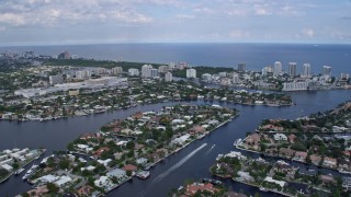 AX0172_060 - 6.7K aerial stock footage of flying over canals and neighborhoods near the coast in Fort Lauderdale, Florida