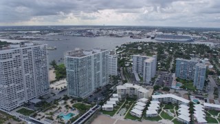 AX0172_065 - 6.7K aerial stock footage pan from beachfront condos to Port Everglades in Fort Lauderdale, Florida