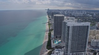 AX0172_071 - 6.7K aerial stock footage flyby condo high-rises in Hollywood, Florida for view of Golden Beach