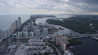 AX0172_074 - 6.7K aerial stock footage the distant Miami skyline seen from Sunny Isles Beach, Florida