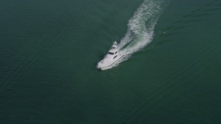AX0172_076 - 6.7K stock footage aerial video of a fishing boat sailing Biscayne Bay in Miami, Florida