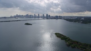 AX0172_077 - 6.7K stock footage aerial video approach causeway and the Downtown Miami skyline, Florida