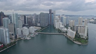 AX0172_086 - 6.7K stock footage aerial video fly over Brickell Key, pan to reveal Miami River in Downtown Miami, Florida