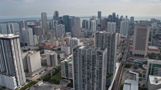 AX0172_089 - 6.7K aerial stock footage of flying past skyscrapers in Downtown Miami, Florida