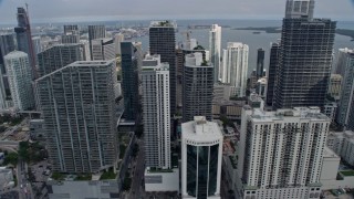 AX0172_094 - 6.7K stock footage aerial video flying by the city's tall skyscrapers in Downtown Miami, Florida