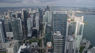 AX0172_095 - 6.7K stock footage aerial video orbit Four Seasons Hotel Miami for wider view of skyscrapers in Downtown Miami, Florida