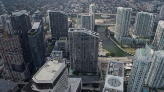 AX0172_097 - 6.7K aerial stock footage flyby Panorama Tower and skyscrapers, reveal river in Downtown Miami, Florida