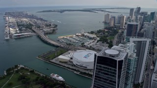 AX0172_098 - 6.7K aerial stock footage orbit arena with view of port, Biscayne Bay, and skyscrapers in Downtown Miami, Florida