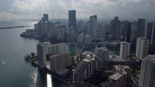 AX0172_118 - 6.7K aerial stock footage of panning across river and skyscrapers in Downtown Miami, Florida