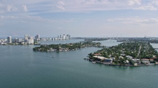 AX0172_124 - 6.7K stock footage aerial video of waterfront mansions on islands in Miami, Florida