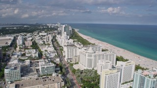 AX0172_132 - 6.7K stock footage aerial video of beachside hotels in South Beach, Miami, Florida