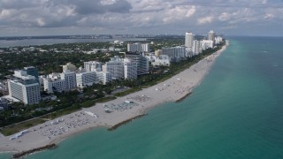 AX0172_134 - 6.7K stock footage aerial video a view of beachside hotels in South Beach, Miami, Florida
