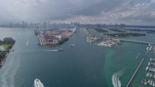 AX0172_145 - 6.7K aerial stock footage of tilting from Government Cut to reveal and approach Port of Miami, Florida