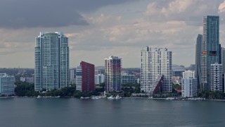 AX0172_148 - 6.7K aerial stock footage of bayside condominium complexes in Downtown Miami, Florida