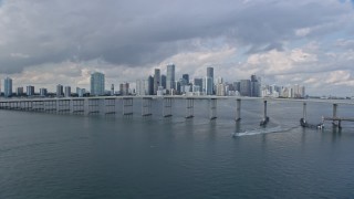 AX0172_151 - 6.7K aerial stock footage reverse view of Downtown Miami, Florida reveal the Rickenbacker Causeway