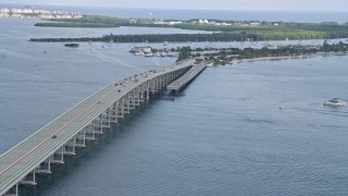 AX0172_155 - 6.7K stock footage aerial video of light traffic on William M Powell Bridge, Miami, Florida