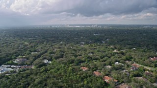 AX0172_158 - 6.7K aerial stock footage of flying by suburban neighborhoods in Coral Gables, Florida