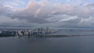 AX0172_162 - 6.7K aerial stock footage of approaching the Downtown Miami skyline, Florida at sunset