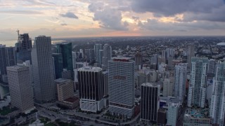 AX0172_166 - 6.7K stock footage aerial video of passing Downtown Miami skyscrapers and city buildings, Florida at sunset
