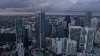 AX0172_171 - 6.7K stock footage aerial video approach and flyby high-rise hotel in Downtown Miami, Florida at sunset