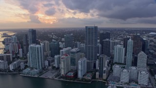 AX0172_172 - 6.7K stock footage aerial video flyby skyscrapers and reveal the river in Downtown Miami, Florida at sunset