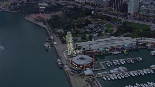 AX0172_192 - 6.7K aerial stock footage reverse view of park and Ferris wheel in Downtown Miami at sunset, Miami, Florida