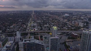 AX0172_200 - 6.7K stock footage aerial video fly over Downtown Miami toward Little Havana at twilight, Florida
