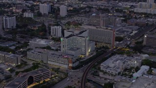 AX0172_202 - 6.7K stock footage aerial video a hospital at twilight, Miami, Florida
