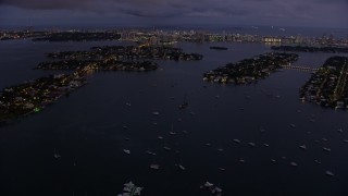 AX0172_215 - 6.7K aerial stock footage of approaching the Venetian Island at twilight, Miami, Florida