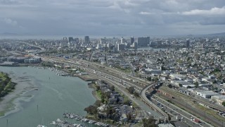 AX0173_0004 - 6K aerial stock footage of approaching the Downtown Oakland from the 880 freeway, California