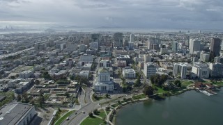 AX0173_0007 - 6K aerial stock footage of flying over Downtown Oakland toward Tribune Tower, California