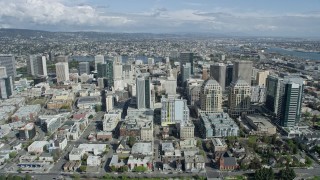 AX0173_0009 - 6K aerial stock footage of flying over Downtown Oakland office buildings toward Lake Merritt, California