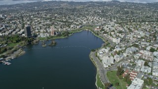 AX0173_0012 - 6K stock footage aerial video of lakefront apartment buildings around Lake Merritt, Oakland, California