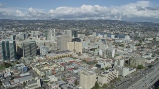AX0173_0017 - 6K stock footage aerial video fly by downtown office buildings in Oakland, California