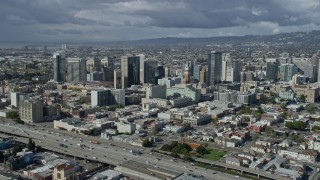 AX0173_0018 - 6K aerial stock footage of passing by downtown office buildings in Oakland, California