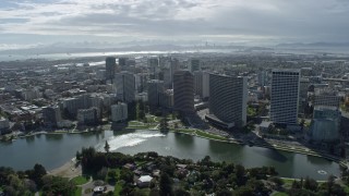 AX0173_0022 - 6K aerial stock footage of passing by lakeside downtown office buildings in Oakland, California