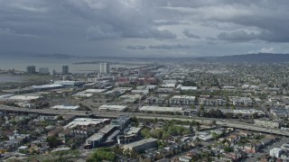 AX0173_0025 - 6K aerial stock footage of shopping mall and apartment buildings in Emeryville, California