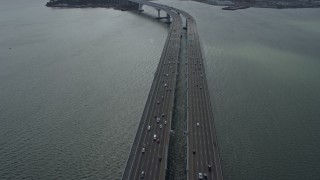 AX0173_0030 - 6K aerial stock footage tilt from traffic for wider view of the Bay Bridge in Oakland, California