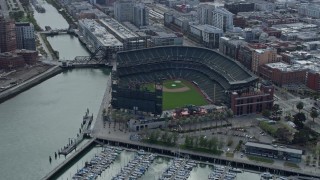 AX0173_0036 - 6K aerial stock footage flying by the baseball stadium in South of Market, San Francisco, California