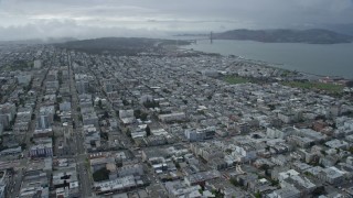 AX0173_0049 - 6K aerial stock footage of approaching the Marina District neighborhood and Golden Gate Bridge in San Francisco, California